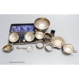 A pair of silver salts (cased), another pair of footed salts, a bowl, two napkin rings, etc.