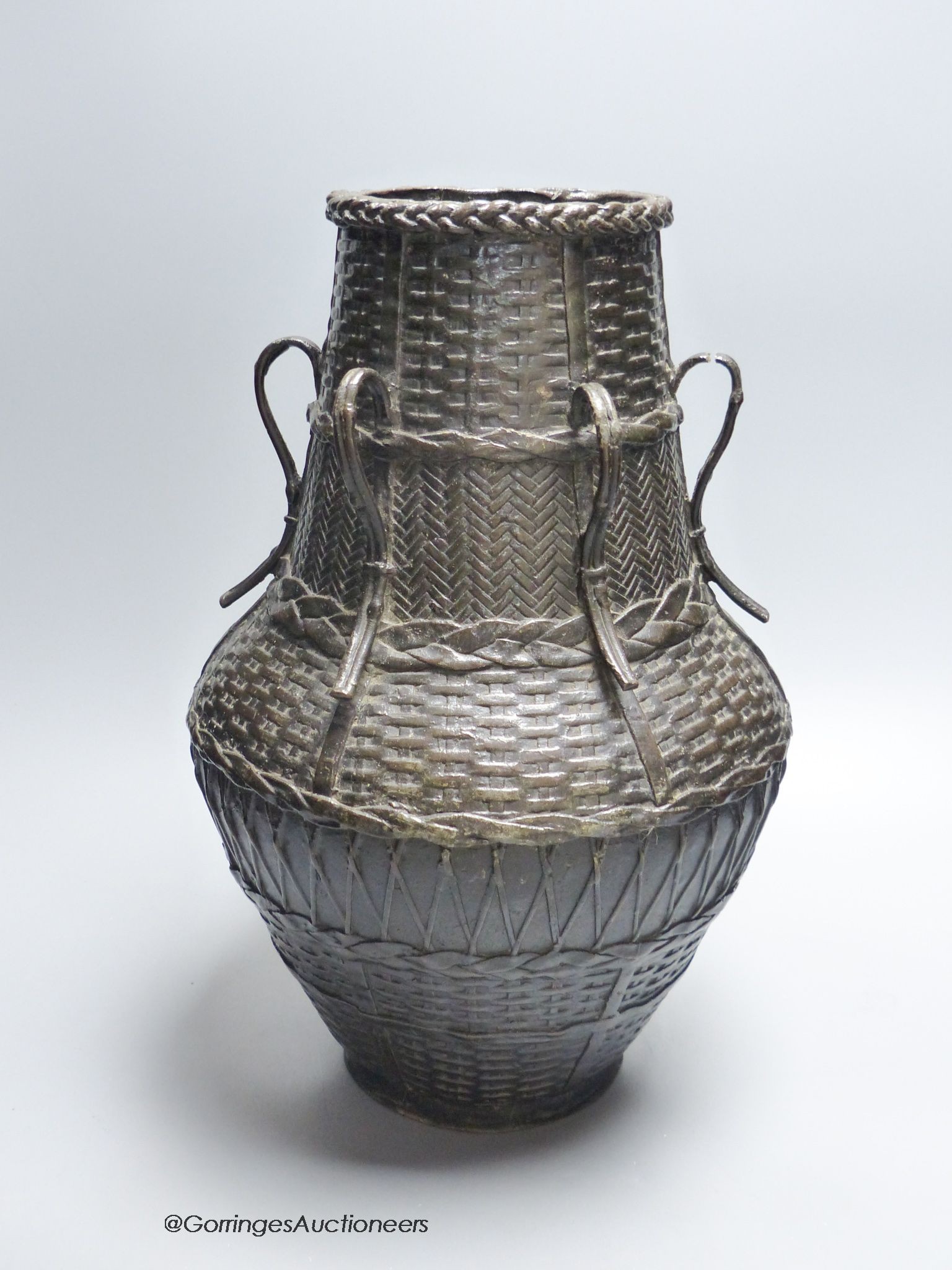 A large Japanese bronze basket effect ikebana vase, Meiji period