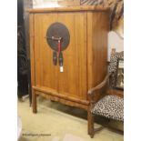 A Chinese metal mounted elm two door cabinet, width 110cm, depth 52cm, height 169cm