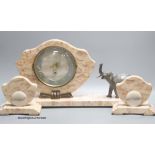 An Art Deco style pink marble 'elephant' clock garniture, length of middle piece 50cm