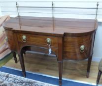 A George III mahogany breakfront sideboard, length 152cm, 116.5cm high to top brass rail, 76cm deep