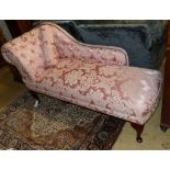 A Victorian style chaise longue upholstered in patterned pink damask, length 160cm, depth 58cm,