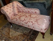 A Victorian style chaise longue upholstered in patterned pink damask, length 160cm, depth 58cm,