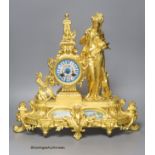 A late 19th century French gilt metal figural mantel clock, with Sevres style inserts, with key and