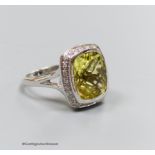 An 18ct white gold, diamond and lemon quartz cluster ring, size N, gross 7.3g.