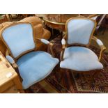 A set of six French beech upholstered dining chairs, two with arms
