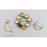 An antique silver and paste brooch, 4cm., a 9ct gold and seed pearl crescent brooch and a gilt