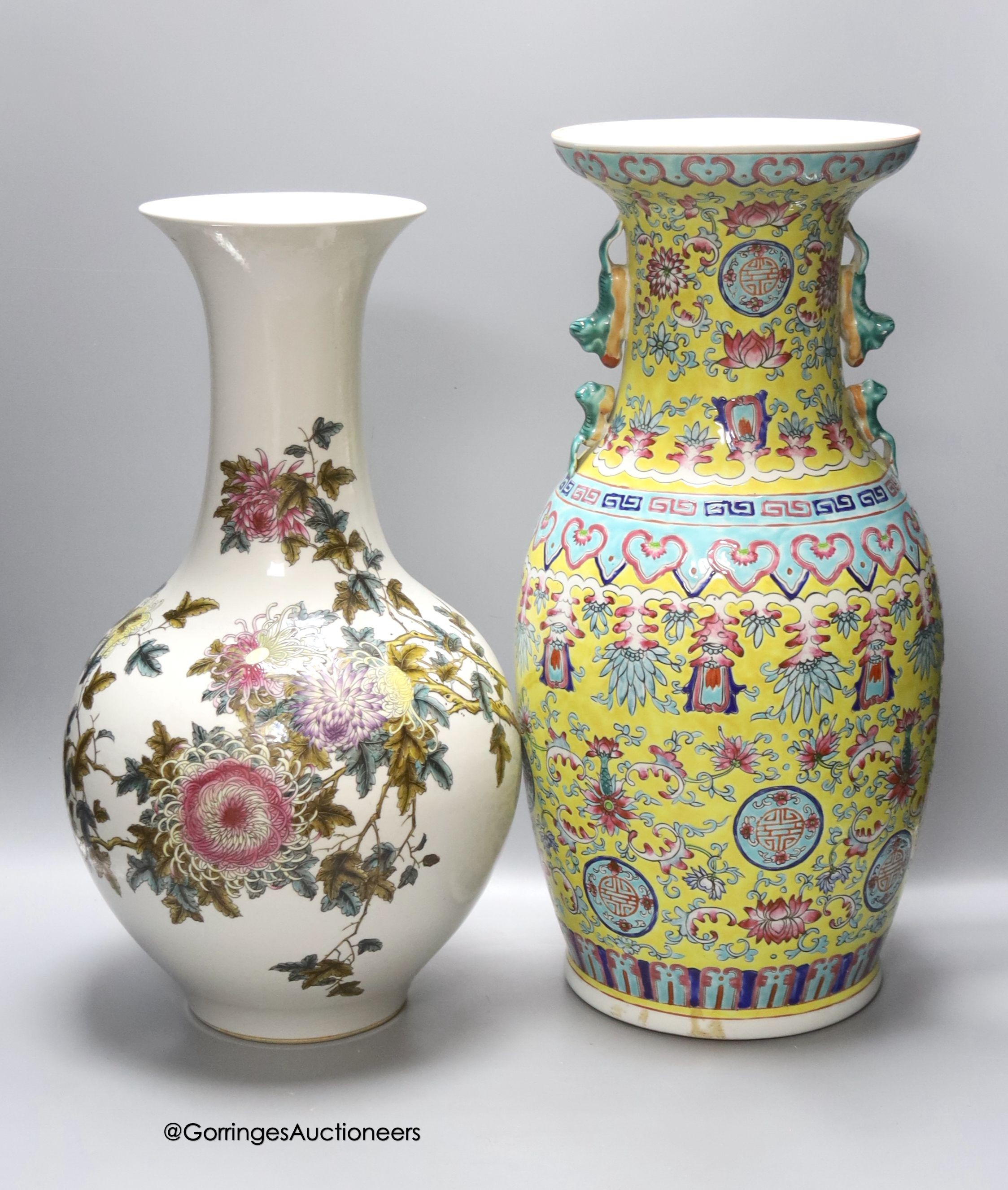 A Chinese yellow ground vase and another painted with chrysanthemums, tallest 46cm
