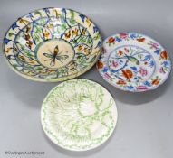 A Moroccan terracotta dish, an Ironstone dish, a green and white leaf dish, largest 30cm