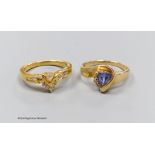 An 18ct gold and diamond dress ring, size N, gross 4.5g, and a 14k gold, diamond and tanzanite
