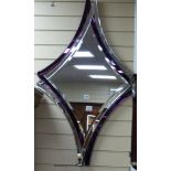 A Deknudt contemporary amethyst tinted mirror, 110cm x 67.5cm