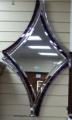 A Deknudt contemporary amethyst tinted mirror, 110cm x 67.5cm