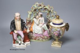 An early 19th century Derby vase, associated cover, a Staffordshire seated gentleman and an arbour