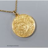 A 15ct engraved gold locket on a fine 9ct gold chain, 8.6g, 2.5cm.