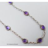 A 20th century white metal and cabochon amethyst set necklace, 41cm.
