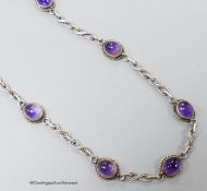 A 20th century white metal and cabochon amethyst set necklace, 41cm.