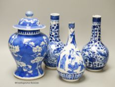 A pair of Chinese blue and white 'dragon' bottle vases, a prunus jar and cover, all late 19th