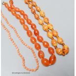 A coral bead necklace, 47cm and two other necklaces.