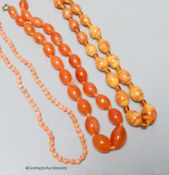 A coral bead necklace, 47cm and two other necklaces.