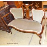 An art nouveau inlaid mahogany settee. W-116, D-54, H-92cm.