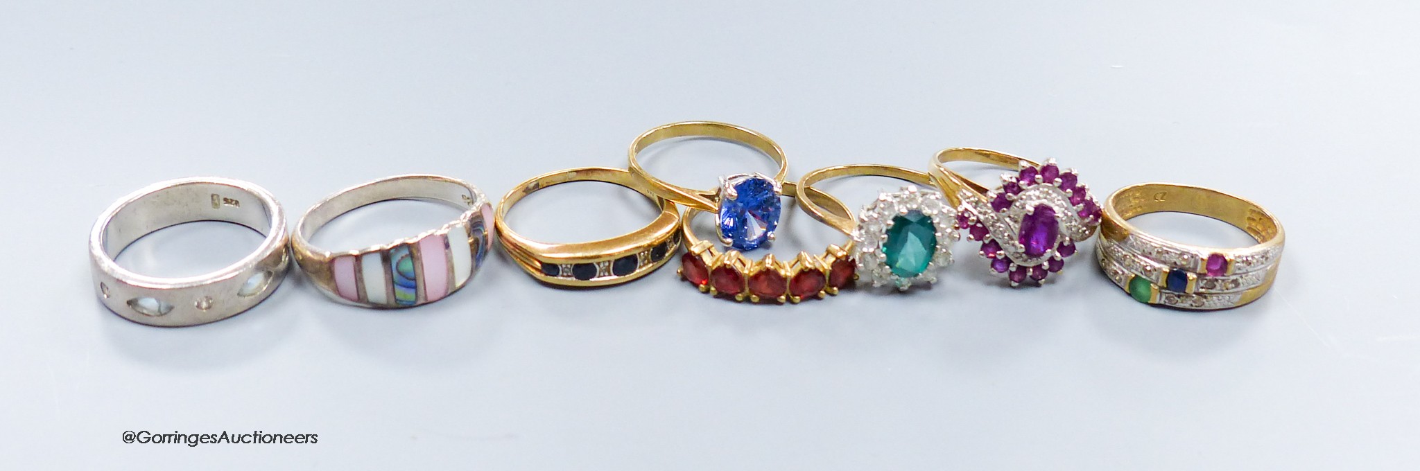 Six 9ct gem-set rings, gross 15.2 grams two white metal rings and silver-gilt bangle.