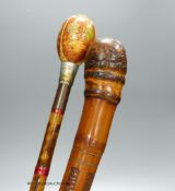 A Japanese carved bamboo walking stick and a Persian polychrome painted walking cane, tallest 97cm