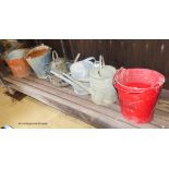 7 galvanised watering cans and buckets.