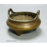 A 19th century Chinese circular bronze tripod censer, diameter 12cm