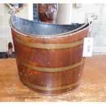 A Victorian toleware peat bucket of elliptical form. W-38, H-34cm.