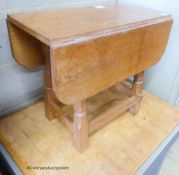 A small 'Beaverman' oak drop leaf occasional table with adzed top, 63cm extended, width 56cm,