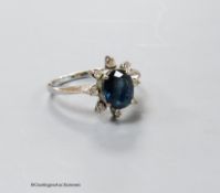 A modern 18k white metal, sapphire and diamond cluster ring, size L, gross 2.5 grams.