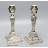 A pair of Edwardian silver pillar candlesticks, by Walker & Hall, Sheffield, 1904, 20.6cm,