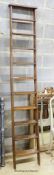 A Victorian oak 10 tread library ladder. W-38, H-229cm.