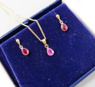 A modern 375 and ruby set drop pendant necklace, 46cm and pair of similar ear studs,gross weight 5