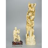 Two early 20th century Japanese walrus ivory okimono, tallest 29cm