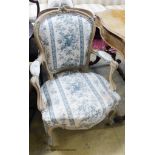 A pair of Louis XVI style upholstered elbow chairs.