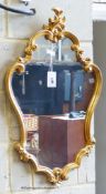 A George III style carved gilt wood mirror. W-70, H-124cm.
