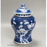 A Chinese blue and white 'prunus' jar and cover, height 22cm