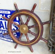 An early 20th century brass mounted mahogany ship's wheel. D-90cm.