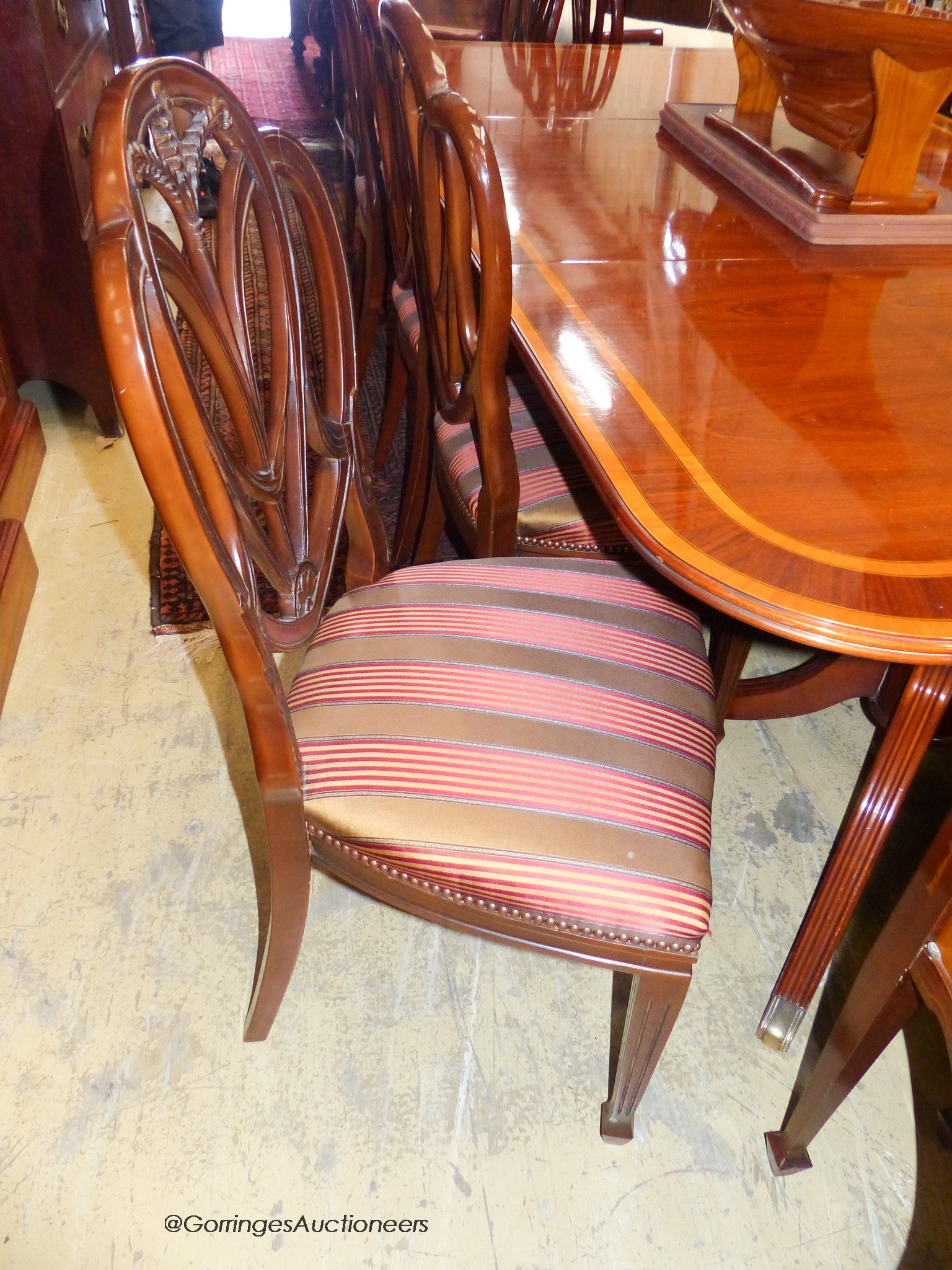 A reproduction Sheraton inlaid mahogany dining room suite, comprising twin pillar extending dining - Image 4 of 4