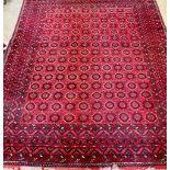 A Turkish red ground carpet. 296x240cm.