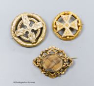 A Victorian yellow metal and enamel brooch, with central cross motif, 31mm and two other brooches