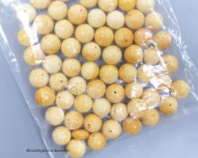 A quantity of loose amber prayer beads.