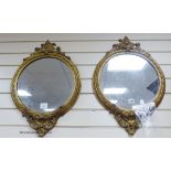 A pair of Victorian circular gilt wood and gesso wall mirrors. W-44, H-64cm.