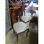 A set of four Edwardian mahogany dining chairs.