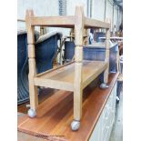 An Arts & Crafts Yorkshire School Malcolm Pipes Foxman oak trolley with original Shepherd castors