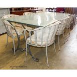 A rectangular glass topped wrought iron garden table and eight chairs. Table, 200x100x75cm.