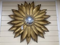 A contemporary gilt metal sunflower convex wall mirror. D-86cm.