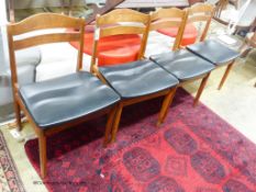 Four Danish teak dining chairs.