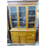 An early 20th century mahogany shopkeeper's bookcase cupboard. W-137, D-50, H-230cm.